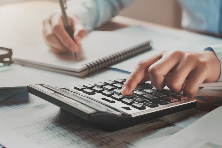 businessman-using-calculator-aia-malaysia