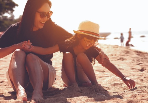 mother-daughter-playing-at-beach-aia-malaysia