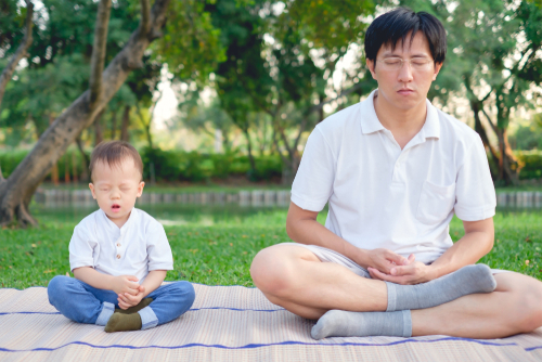 father toddler meditating