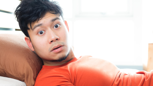 man wakes up surprised