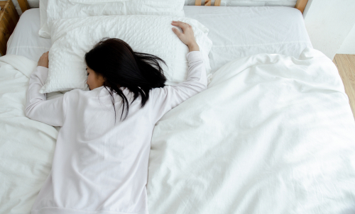 woman sleeping on stomach