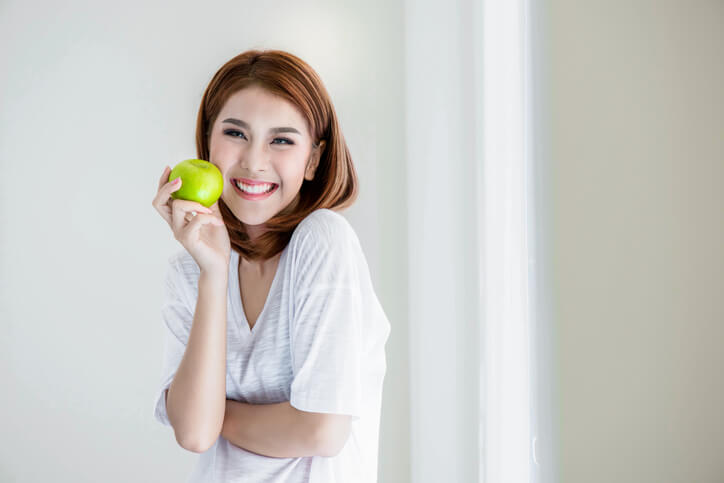 Woman Holding Green Apple