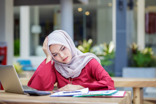 woman working hand on head stressed
