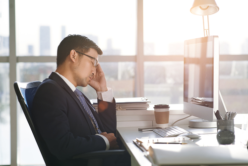man working desktop stressed