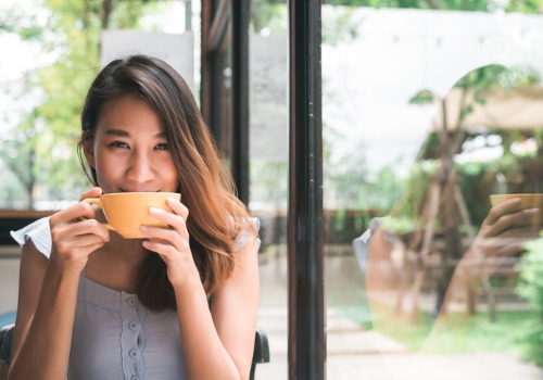 cheerful-woman-drinking-warm-coffeeaia-malaysia