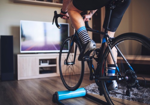 man-cycling-indoor-with-exercise-bike-trainer-aia-malaysia