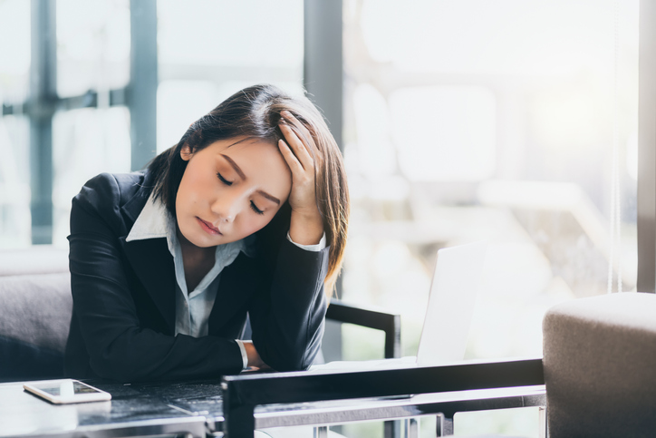businesswoman-holding-head-aia-malaysia