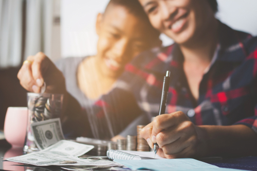 mom and son looking at savings