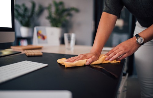 businesswoman-wiping-sher-work-desk-aia-malaysia