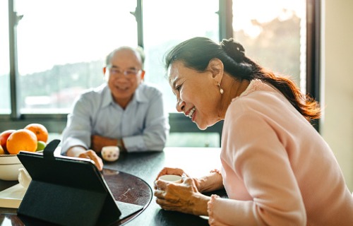 chinese-senior-couple-having-video-call-at-home-aia-malaysia
