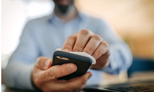 man-cleaning-smartphone-aia-malaysia