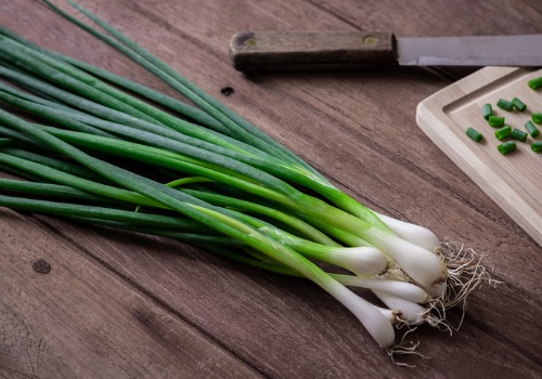 fresh-green-onion-on-wooden-table-aia-malaysia