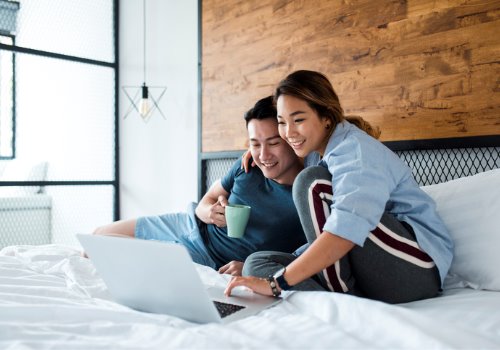 chinese-couple-drinking-laptop-bed-aia-malaysia