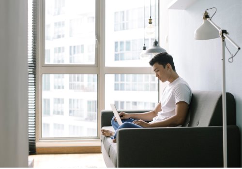 man-working-home-focused-light-sofa-aia-malaysia