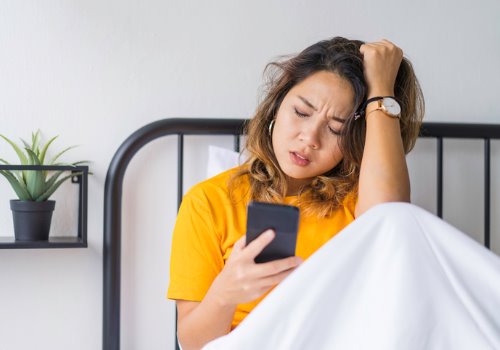 young-asian-woman-bad-news-phone-morning-aia-malaysia