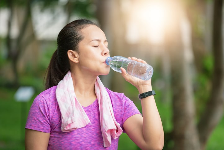 woman-drinking-water-after-workout-aia-malaysia