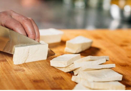 chefs-hands-slicing-tofu-cheese-with-knife-aia-malaysia