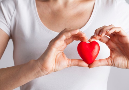 young-woman-holding-red-heart