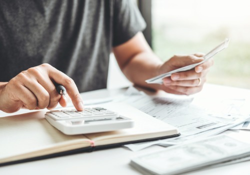 man-using-calculator-accounting-calculating-cost-economic-bills-budgeting-aia-malaysia.jpg