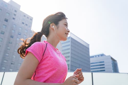 asian woman jogging