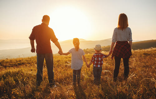 family looking at sunset