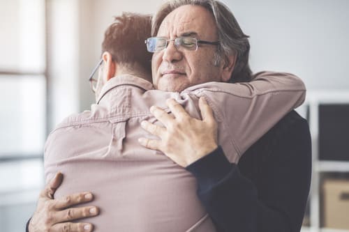 son hugs father