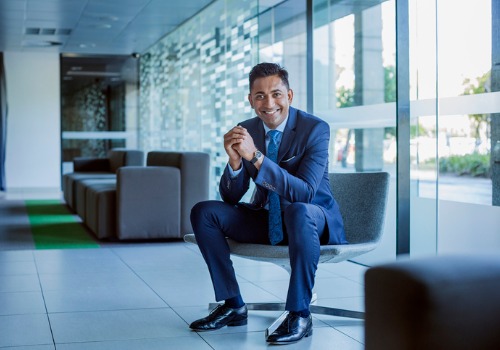 happy-businessman-sitting-in-office-lobby-aia-malaysia
