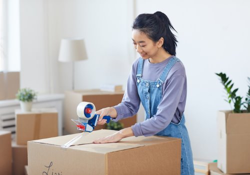 asian-woman-packing-boxes-moving-aia-malaysia
