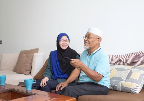 elderly-malay-couple-sitting-on-the-couch