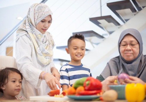 mother-and-grandmother-teaching-the-children-how-to-prepare-food
