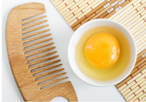 raw-egg-in-the-small-white-bowl-and-wooden-hair-comb-natural-homemade-picture-aia-malaysia