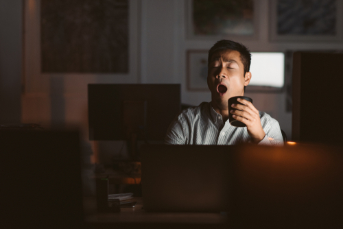 man sleepy drink coffee