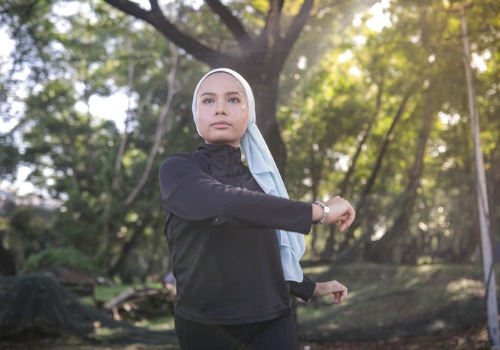 woman-exercising-stretching-in-park-aia-malaysia