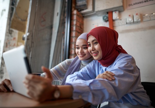 malaysian-beautiful-young-women-in-hijab-using-digital-tablet-in-a-picture-aia-malaysia