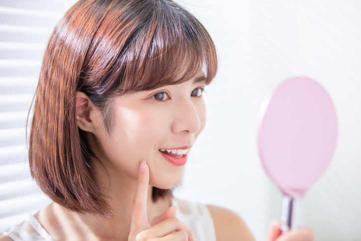 Woman showing clear skin