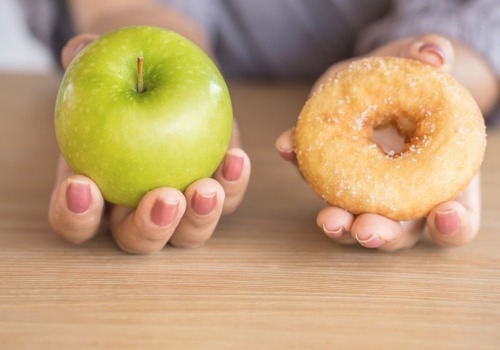 woman-hands-holding-green-apple-and-donut-picture-aia-malaysia