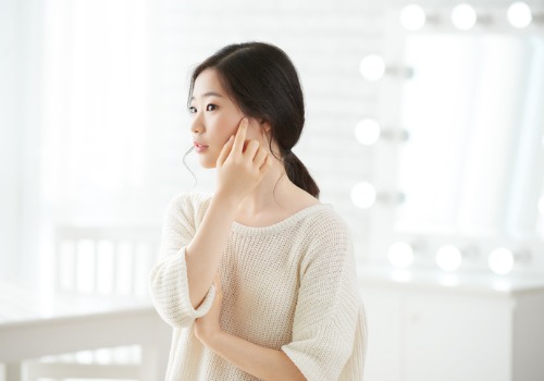 korean girl touching skin