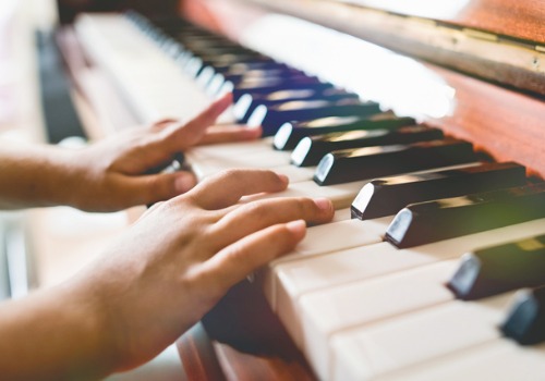 child-girl-playing-piano-close-up-view-picture-aia-malaysia