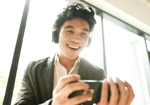 young-asian-man-is-watching-music-video-on-mobile-picture-aia-malaysi