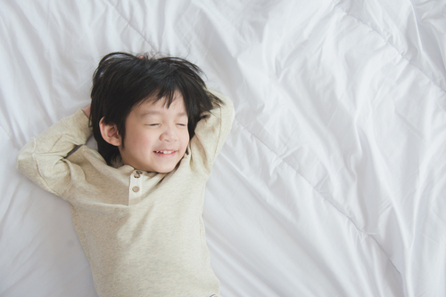 yawning-on-bed