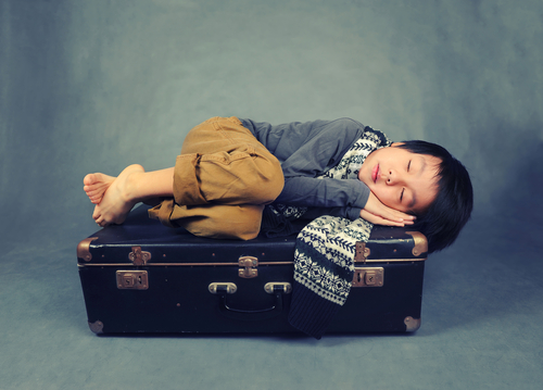 BOY SLEEPING FETAL POSITION