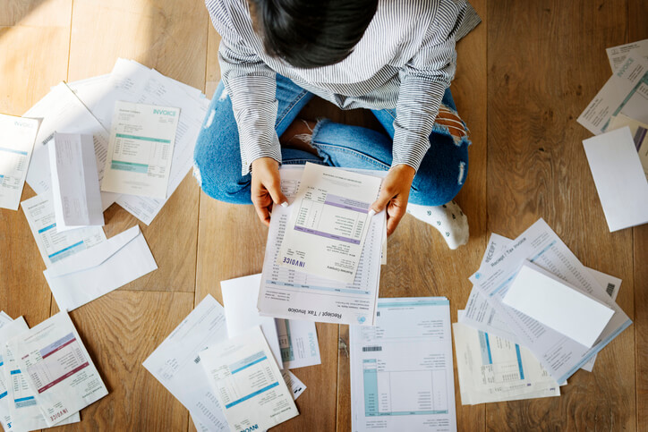 Woman Looking at Bills