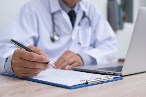doctor-writing-on-paper