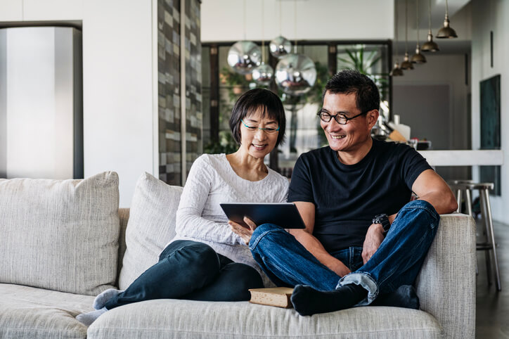 Old Couple Looking at Tablet